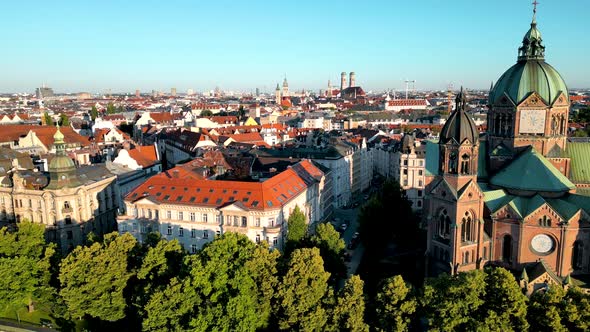 Panorama aerial view Munich downtown sunrise. Drone flies over residential area of central bavarian