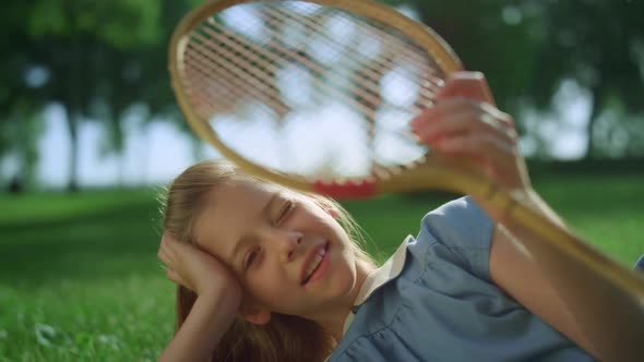 Blond Girl Lying in Golden Sunlight Close Eyes