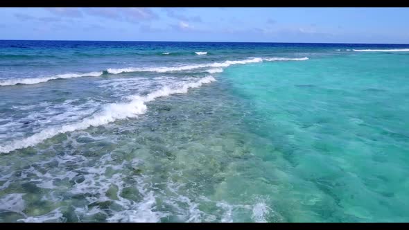 Aerial view sky of tranquil coastline beach vacation by clear lagoon and white sandy background of a