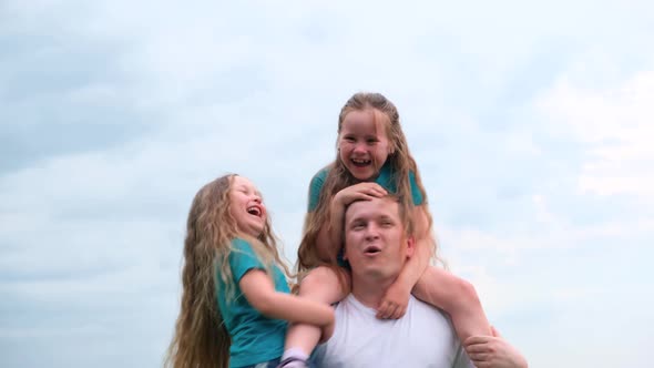 Happy Father and Two Little Daughters Laughing Spending Time Dad and Daughters Playing Together