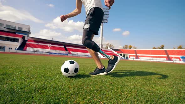 Ball Is Getting Kicked By a Man with a Bionic Leg