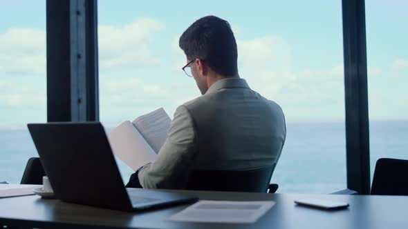 Unknown Manager Checking Documents at Marina View