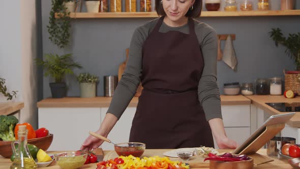 Smiling WomanPosing on Camera in Kitchen