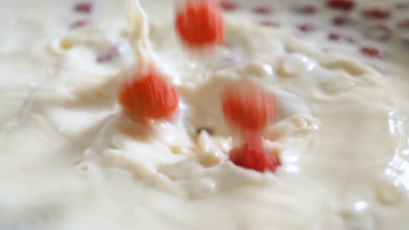 Berries Falling Into a Bowl with Yogurt Slow Motion