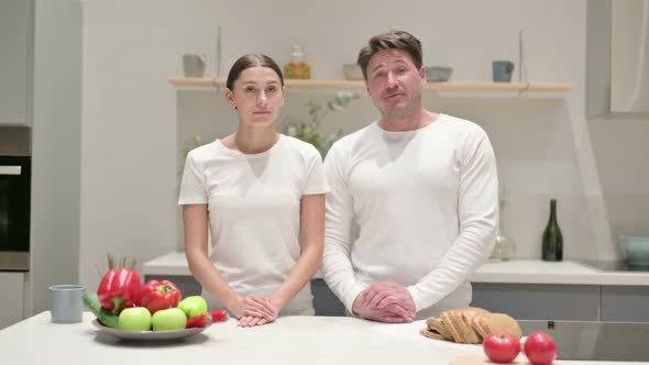 Mixed Race Couple Doing Video Call While Standing in Kitchen