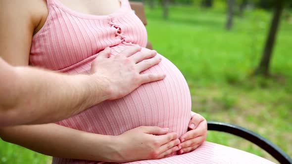 Happy Pregnant Woman Sitting Park Bench Gently Stroking His Stomach His Hand Summer Sunny Day