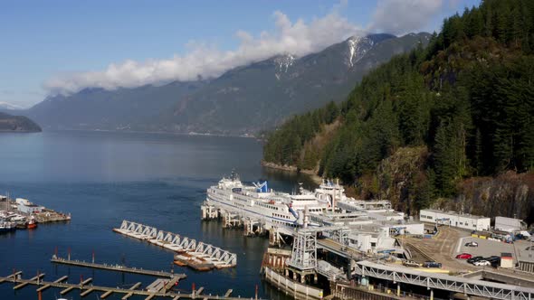 Ferries Docked On Horseshoe Bay With Beautiful Forest Mountains At Background In West Vancouver, Can