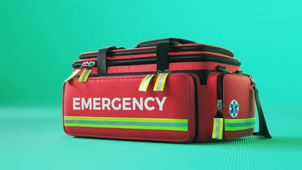 The red emergency first aid bag in colorful studio light. Paramedic kit. 4KHD