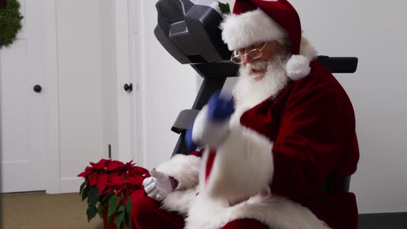 Santa Claus lifting weights in gym alt