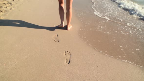 Young Woman Legs Walking on White Sand with Waves at Beach in Island, Cinematic