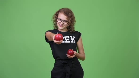 Young Beautiful Nerd Woman Giving Apple