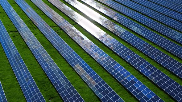 Drone View Blue Solar Panels Pattern on Nature Background