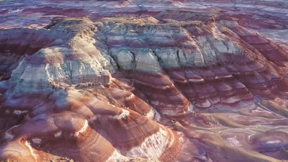 Sunlight Glowing on Pink Purple Desert Sandstone Rock Formations Wavy Pattern
