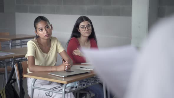 Multi Ethnic High School Female Students Listening Presentation Explanation of Teacher or Classmate