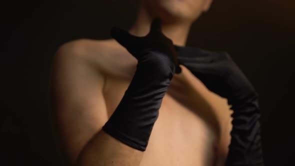 Man Wearing Female Gloves, Touching Body, Trying to Determine Gender Identity