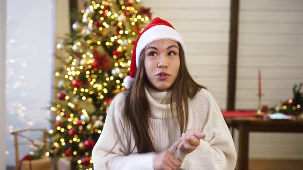 The Girl Waves Her Hand To the Camera on New Years Eve