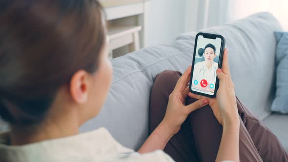 Asian young woman patient talking virtual online with medical doctor.