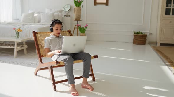 Schoolboy is Watching Educational Videos for Children on Laptop and Listening By Headphones Drawing
