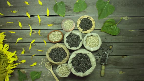 Seeds and sunflowers on an old wooden table. Top view.