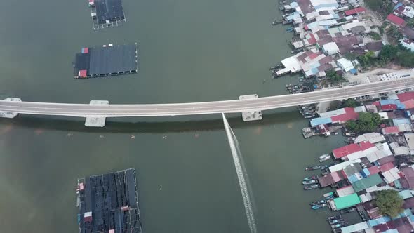 A boat sail below Kuala Kurau bridge 