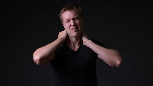 Young Handsome Man Against Black Background