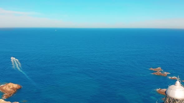 Aerial View of a Lighthouse Named Faro Cabo De Palos Located on the Top of a Cliff 