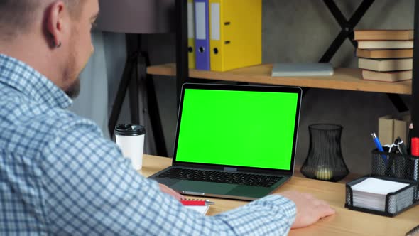 Green screen laptop concept: Businessman listen tells employee online video call