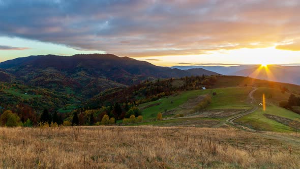 Scenic View of Mountains Against Sky During Sunset