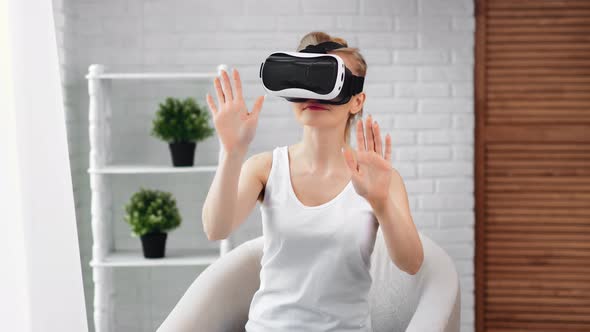 Amazed Girl in Virtual Reality Helmet Immersing at Cyberspace