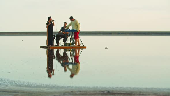 Band on a Little Raft Is Floating in the Sea While Playing Relaxing Music, 