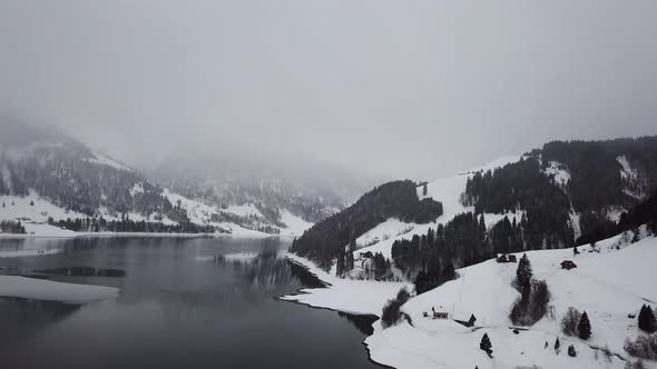 Panorama shot of a mirroring lake in Switzerland while winter.