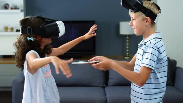 Kids using virtual reality headset in living room