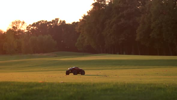 RC Car Rides on a Green Golf Field.