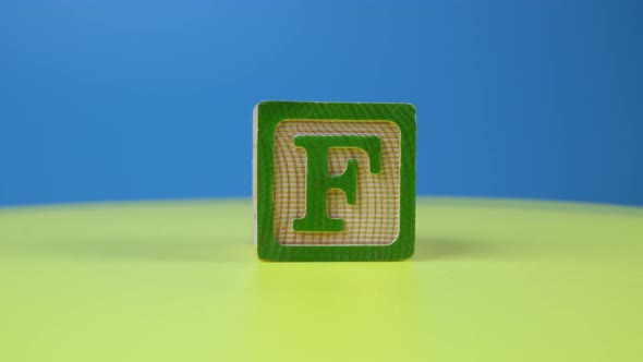 Close up shot letter "F" alphabet wooden block
