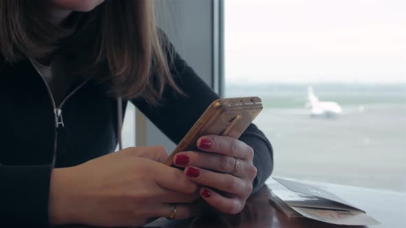 Girl With Phone Waiting For Flight