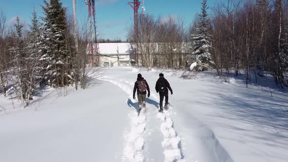 Documentary Makers Walking to Telecom Base Towers