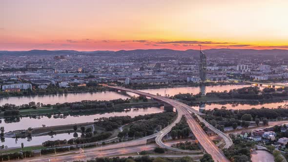 Aerial Panoramic View Over Vienna City with Skyscrapers Historic Buildings and a Riverside Promenade