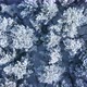 Aerial fly over frozen snowy covered coniferous forest trees. - VideoHive Item for Sale