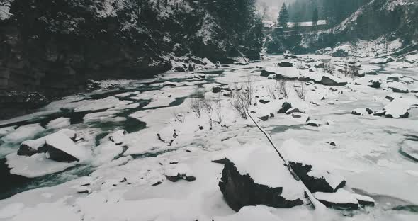 Closeup Aerial of Mountain River Flowing