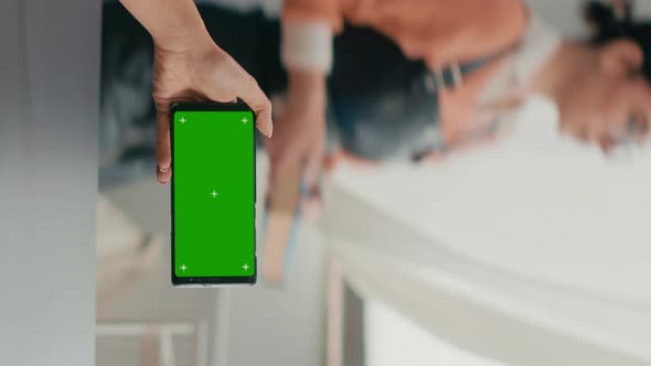 Vertical Video Business Woman Holding Phone with Mock Up Green Screen Chroma