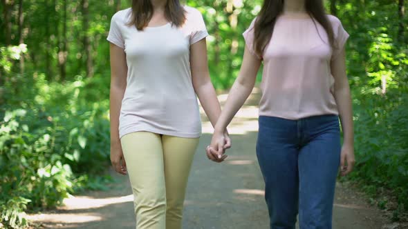 Lesbian Couple Walking Together, Holding Hands, Free Choice of Love No Prejudice