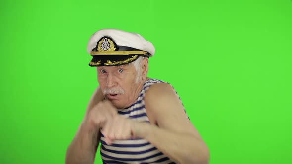 Elderly Sailor Man Is Angry and Shows a Fists. Sailorman on Chroma Key