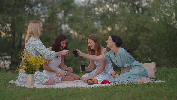 Young Women After Modeling From Clay Discuss the Resulting Products Drink Tea Coffee Drinks Laugh