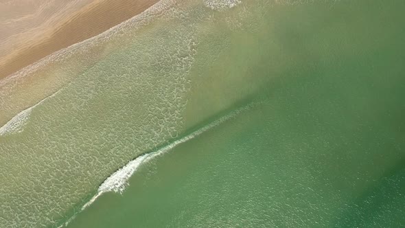 Waves Breaking On a Sandy Beach 4K