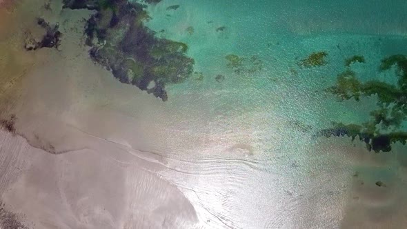 RISING AERIAL of a turquoise beach on New Zealands South Island