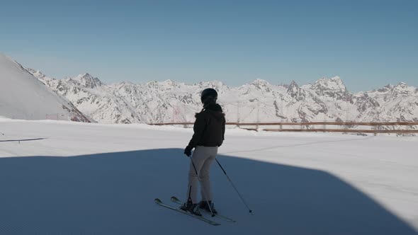 Woman Skiing Along Snow In Solden