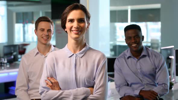 Business colleagues standing with arms crossed 4k