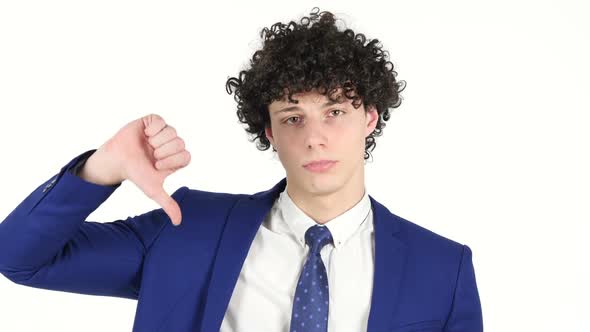 Thumbs Down by Young Businessman