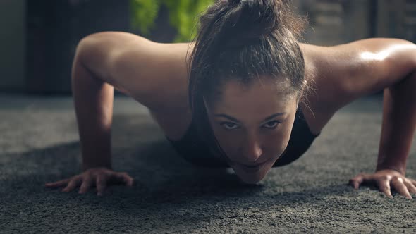 Detail of Woman Exercising on the Floor at home.Woman Doing Push-ups at Home. Woman Fitness Training