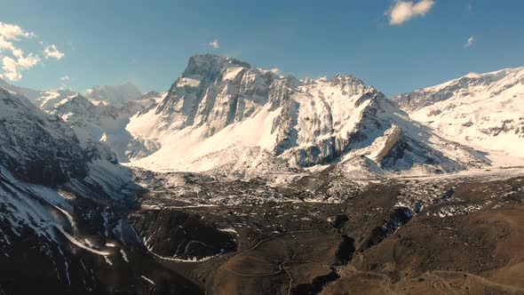 Beautiful Aerial Shot closing on Snowy Mountain Range at Cordillera de los Andes, Chile-4K